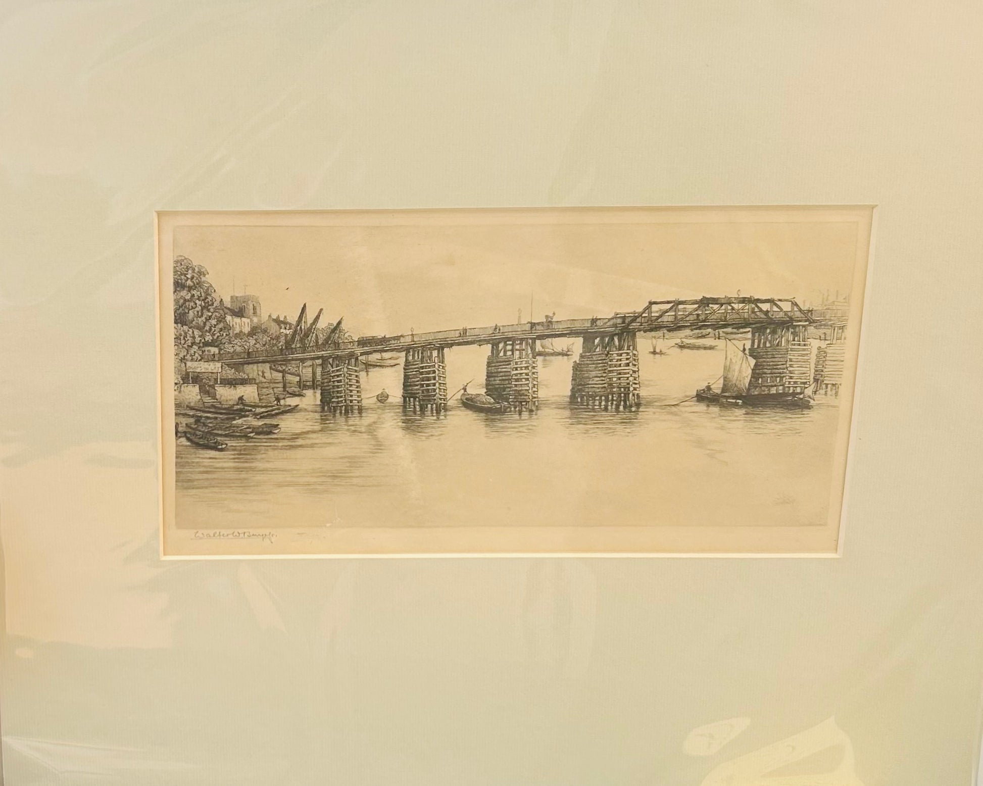 Monochrome etching by Walter W. Burgess showing a riverside scene with wooden pier, small boats, and background buildings, c.1890s Old Putney Bridge
