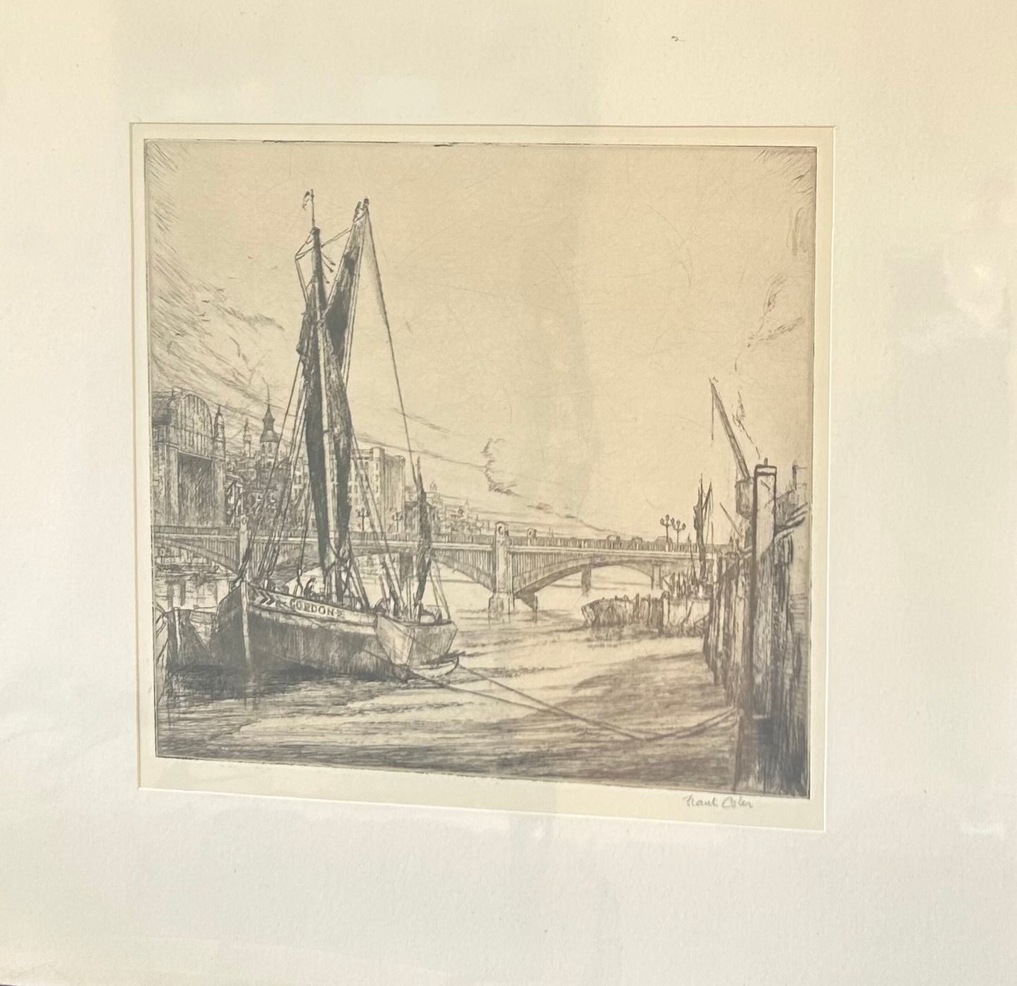 Signed etching by Frank Osler showing the Thames sailing barge “Gordon” on the River Thames in London with bridge and city buildings in the background, 1930s.