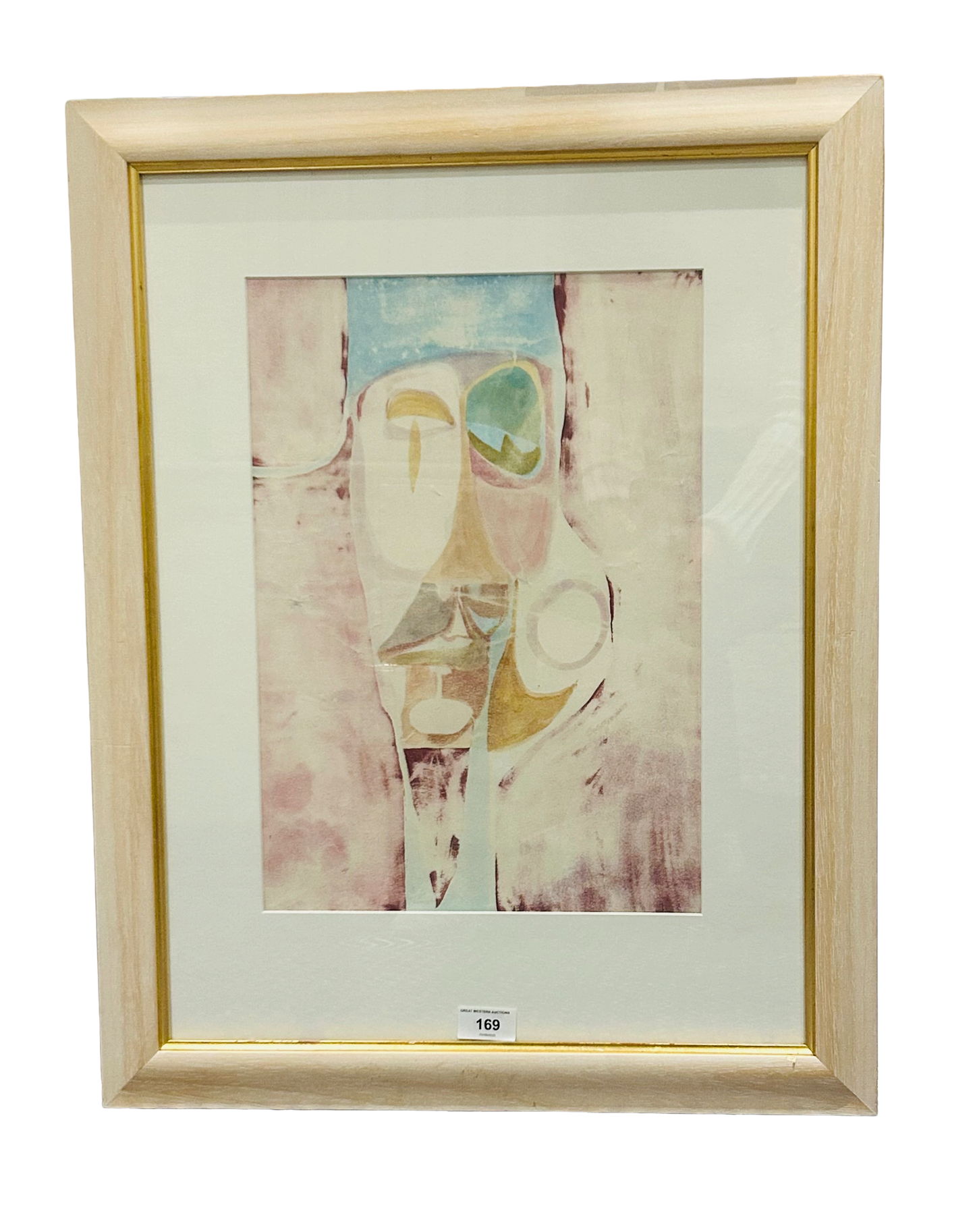 Framed abstract artwork by Tom Murdoch titled “Graven Image” (1969), featuring pastel tones and stylized facial forms in mixed media.